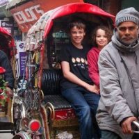Traditional rickshaw tour exploring Kathmandu streets with local cultural experience.