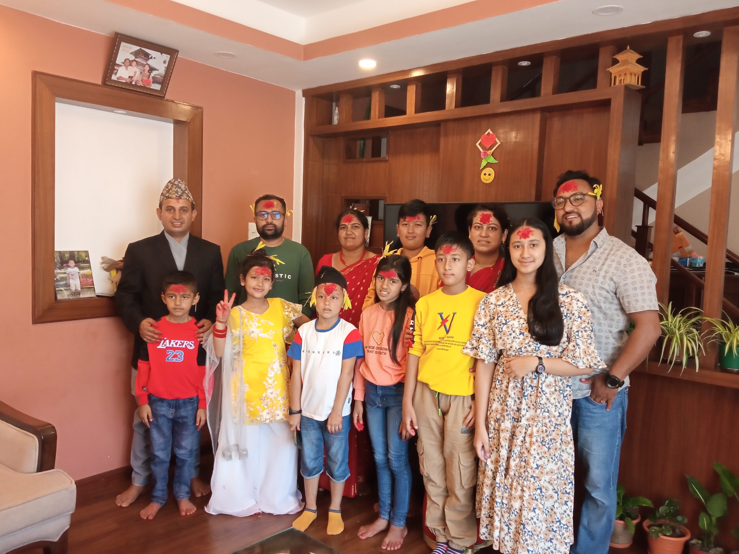 Family celebrating Dashain festival in Nepal with Tika and Jamara, colorful decorations, and traditional rituals.