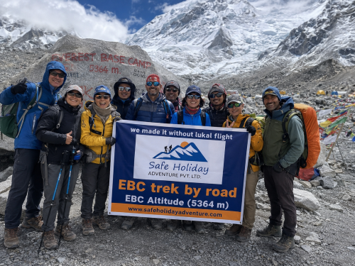 EBC trek without Lukla Flight with trekkers walking through Himalayan mountain trail in Nepal