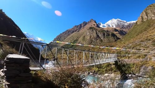 Tsum Valley Trek trail with traditional Tibetan villages and Himalayan mountain views in Nepal