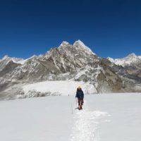 Mera Peak Climbing - Snow-covered Mera Peak rising above -clouds in the Himalayas