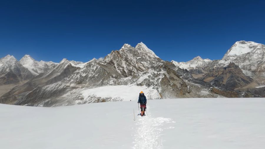 Mera Peak Climbing - Snow-covered Mera Peak rising above -clouds in the Himalayas