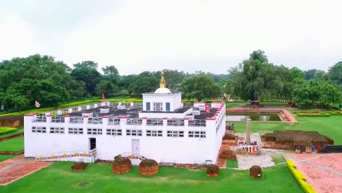 Tourists visiting Lumbini with Safe Holiday Adventure, exploring the Maya Devi Temple and surrounding peaceful gardens.