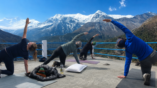 Yoga session with Himalayan mountain views during the Annapurna Circuit Yoga Trek in Nepal